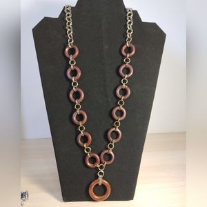 Vintage wooden necklace with brass and stainless steel rings. 14"